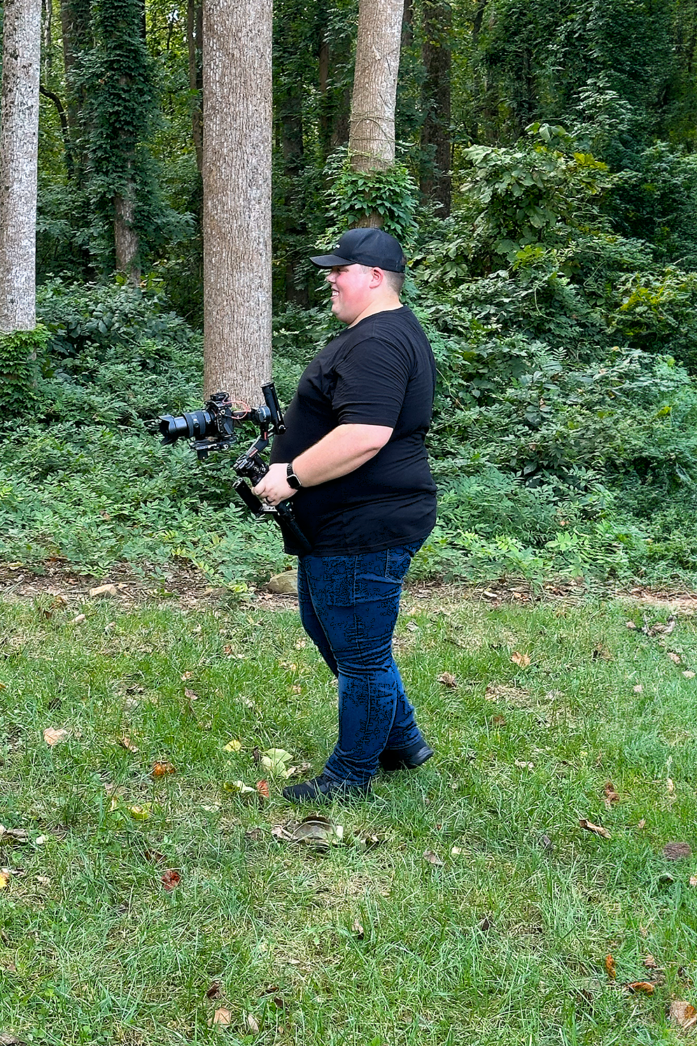 C3 Productions videographer operating a gimbal-stabilized camera on a video shoot in the Raleigh-Triangle area, NC