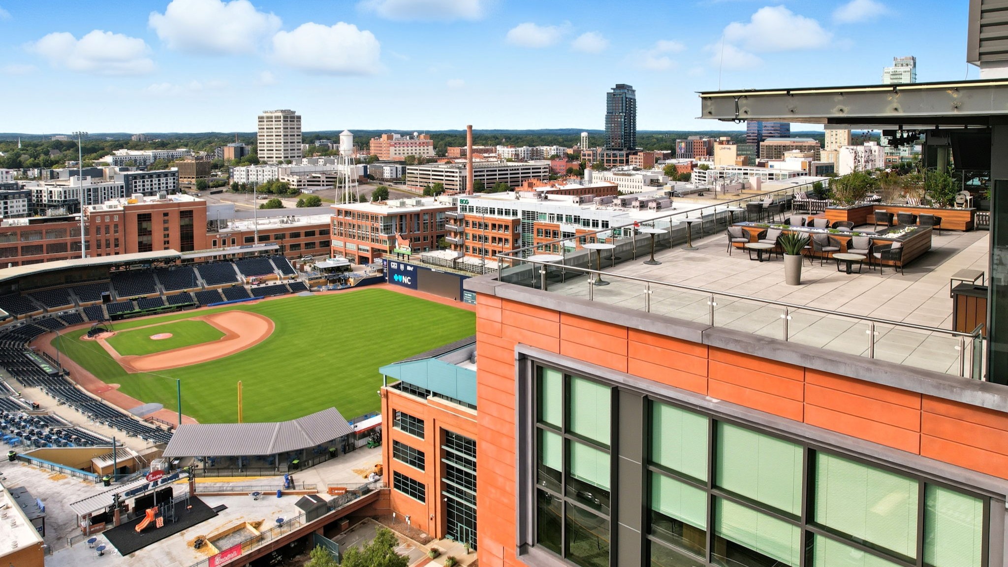 Aerial real estate photography of a downtown high-rise and skyline in Durham, NC