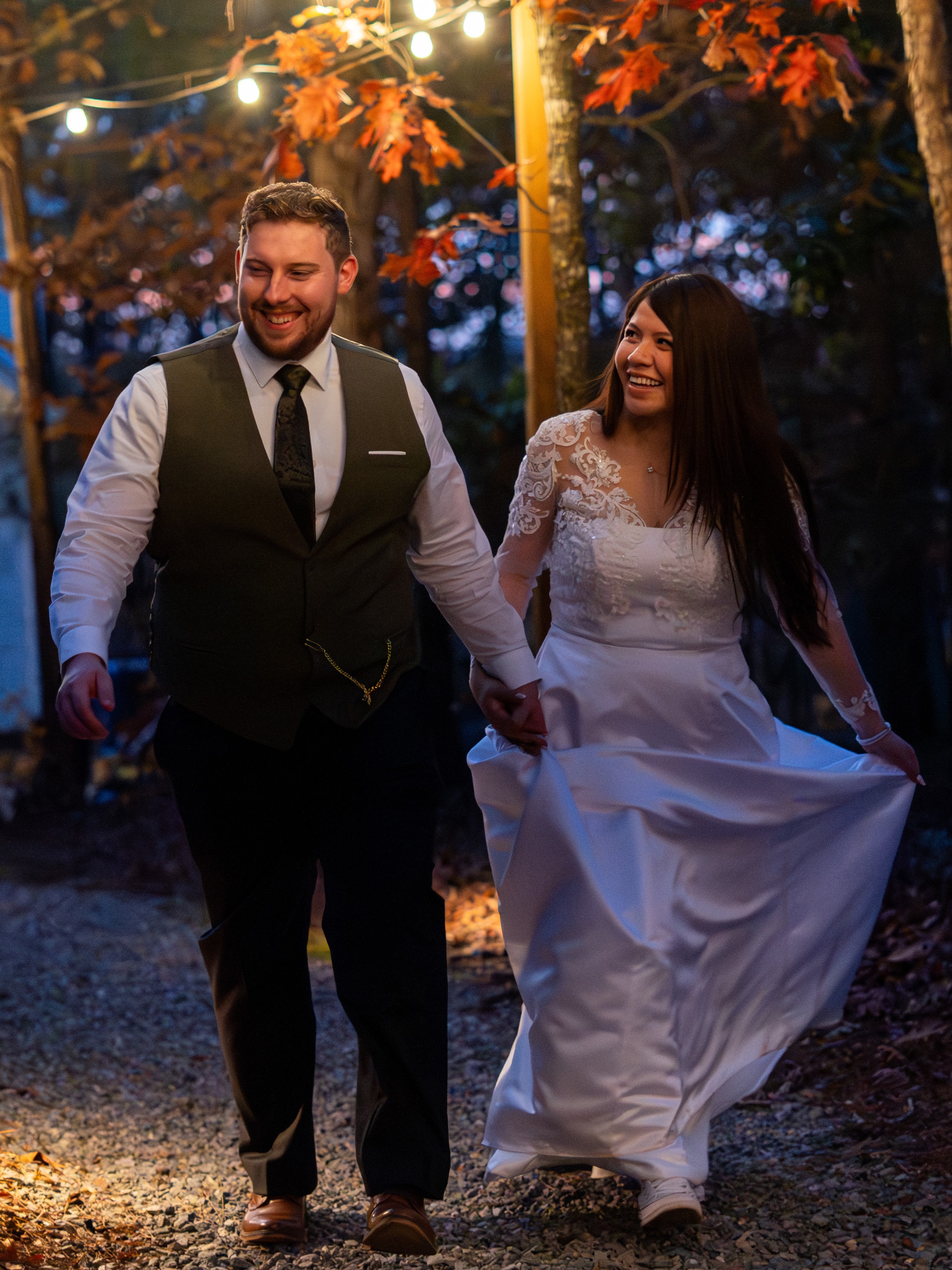 Wedding photography of a couple walking at an autumn evening reception in the Triangle, NC